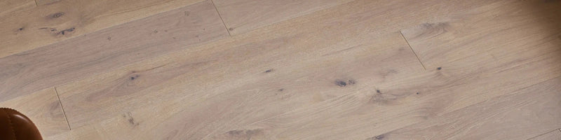 Light-colored woodpecker stonehaven engineered oak flooring planks with natural grain and subtle knots