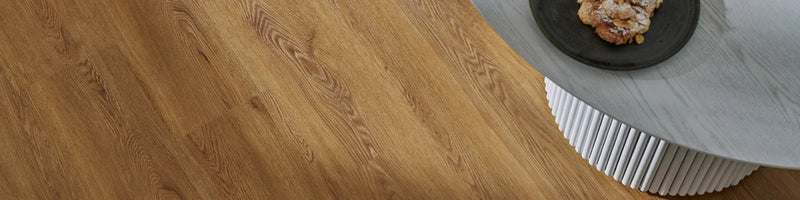 A sleek light brown woodpecker weymouth waterproof lvt flooring with natural grain pattern in wooden material.