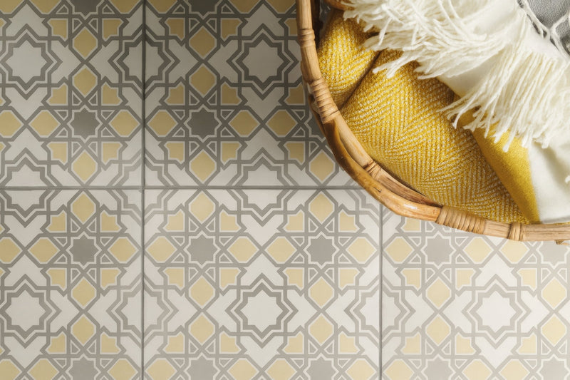 Woven bamboo basket holding yellow and white textiles from the yellow bathroom tiles collection