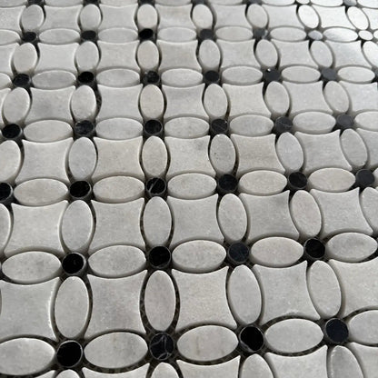 Black dot Carrara marble flower mosaic used as a cloakroom floor