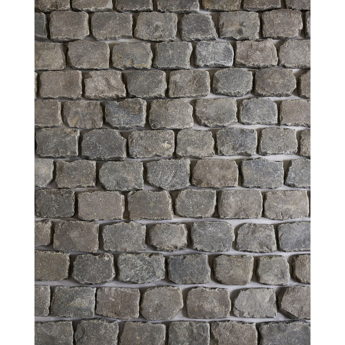 Reclaimed Antwerp Granite Cobbleheads in grey tones