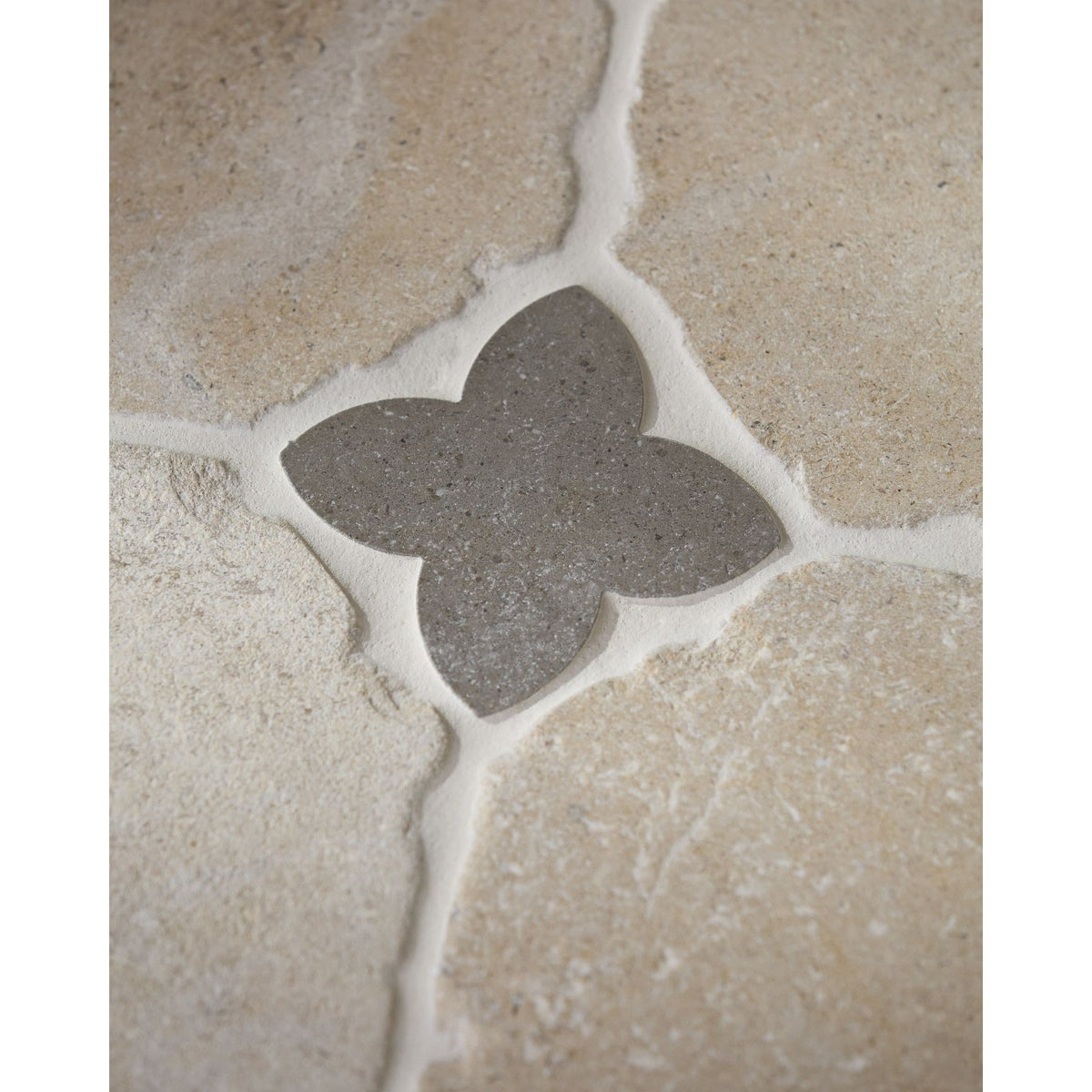 Clover Cabochon in Hazlebury Limestone set into a Lacock limestone floor
