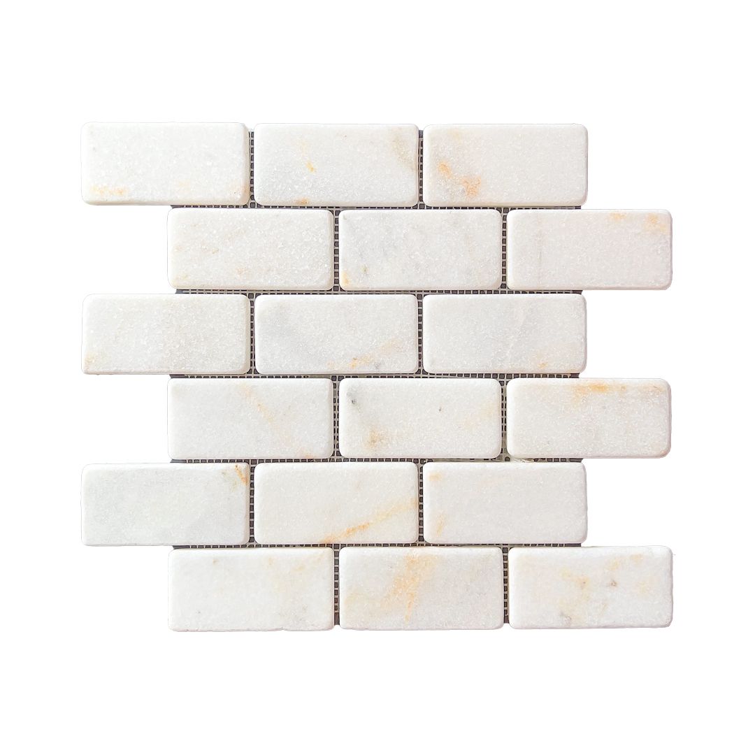 Calacatta Sugar tumbled marble brick mosaic sheet in white with soft gold veining