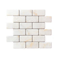 Calacatta Sugar tumbled marble brick mosaic sheet in white with soft gold veining