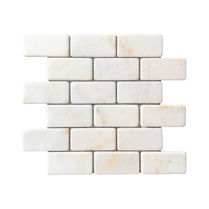 Calacatta Sugar tumbled marble brick mosaic sheet in white with soft gold veining