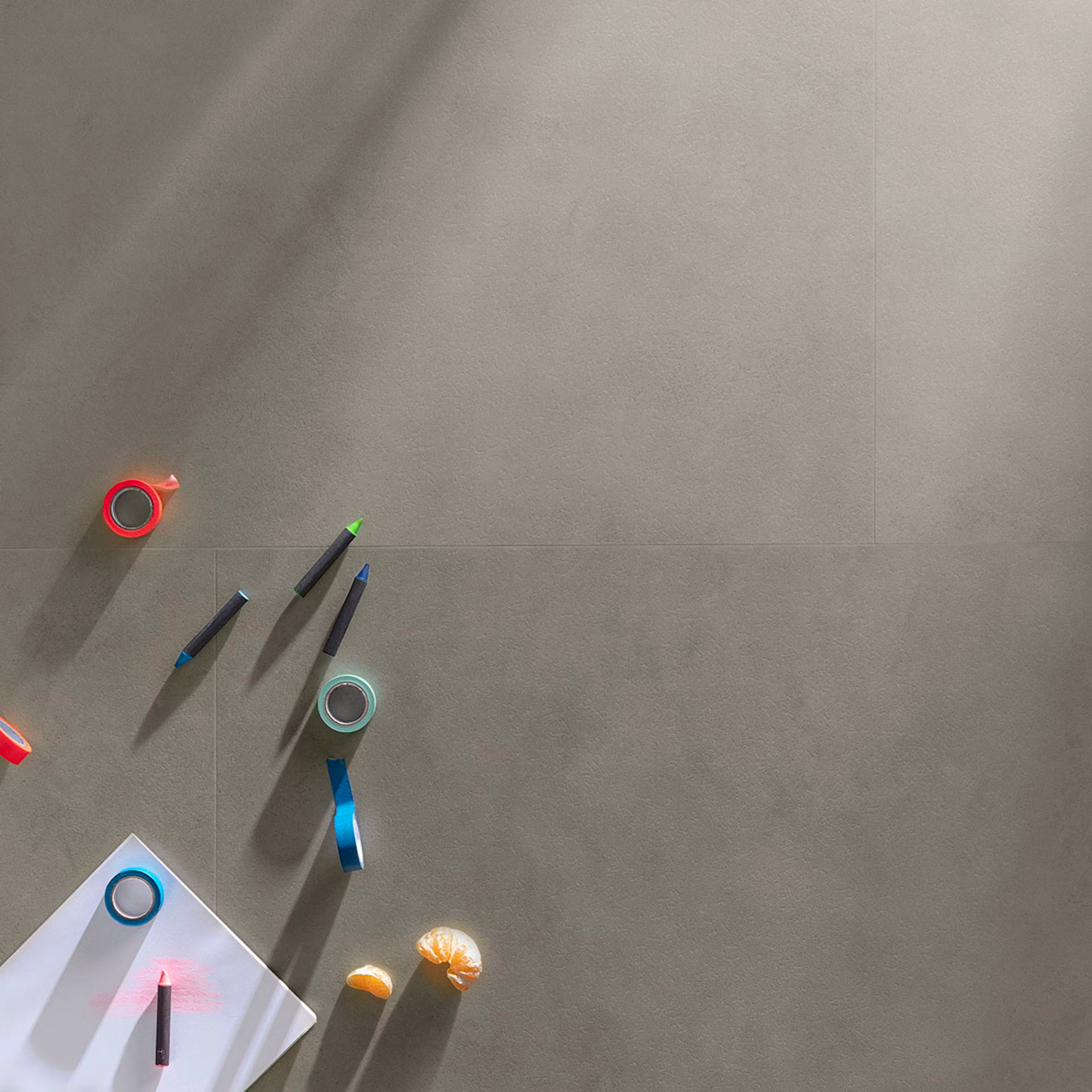 Colorful tape and pens on a gray surface