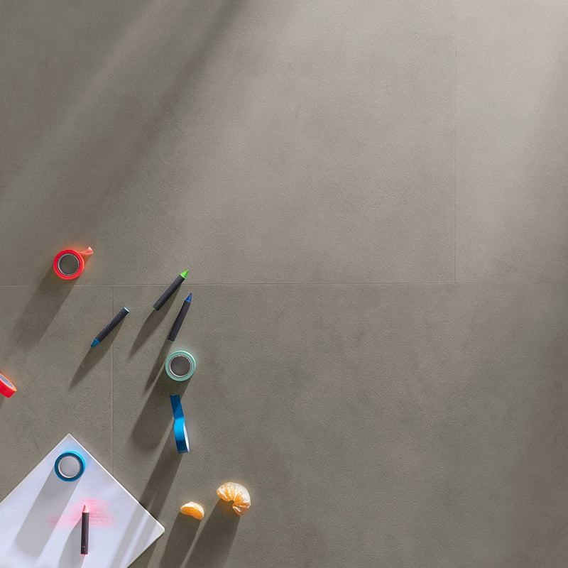 Colorful tape and pens on a gray surface