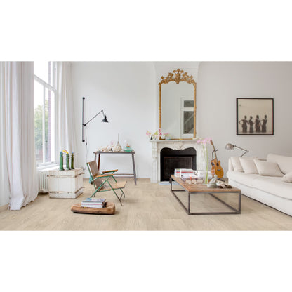 Modern living room with white walls, a fireplace, and decorative items.