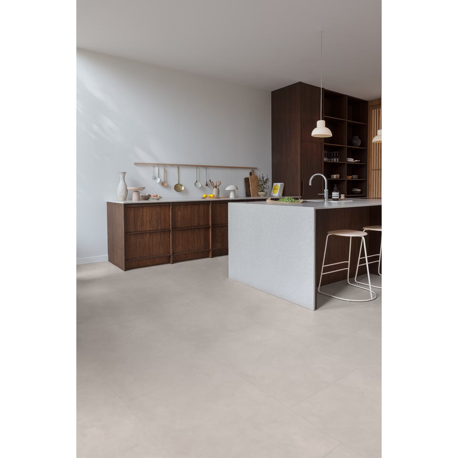 Minimalist kitchen featuring pebble beach f030 big vinyl tiles with dark wood cabinetry and a white island