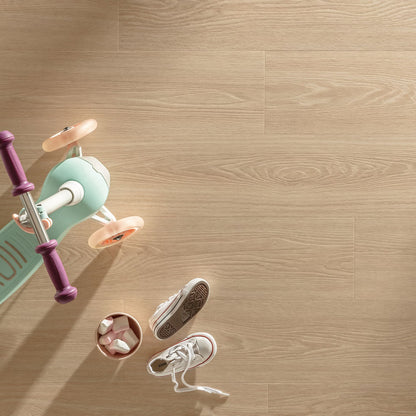 Mint green and purple children’s scooter with peach-colored wheels on waffle F057 vinyl plank flooring