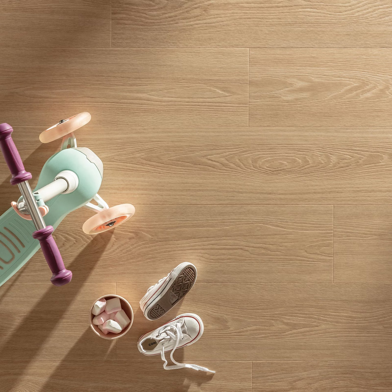 Mint green and purple children’s scooter with pink wheels on cannelé f058 vinyl planks floor