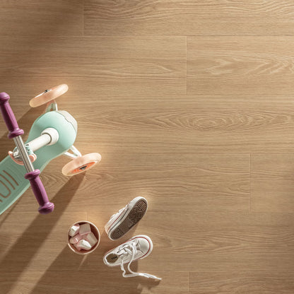 Mint green and purple children’s scooter with pink wheels on cannelé f058 vinyl planks floor
