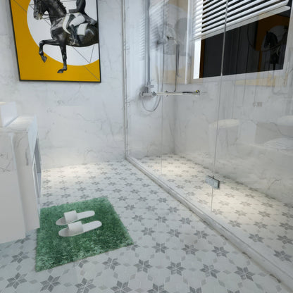 Honed Carrara and Platinum Grey starline marble mosaic laid as a bathroom floor