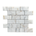 Full sheet of Calacatta Sugar honed marble brick mosaic showing grey veining across staggered white bricks