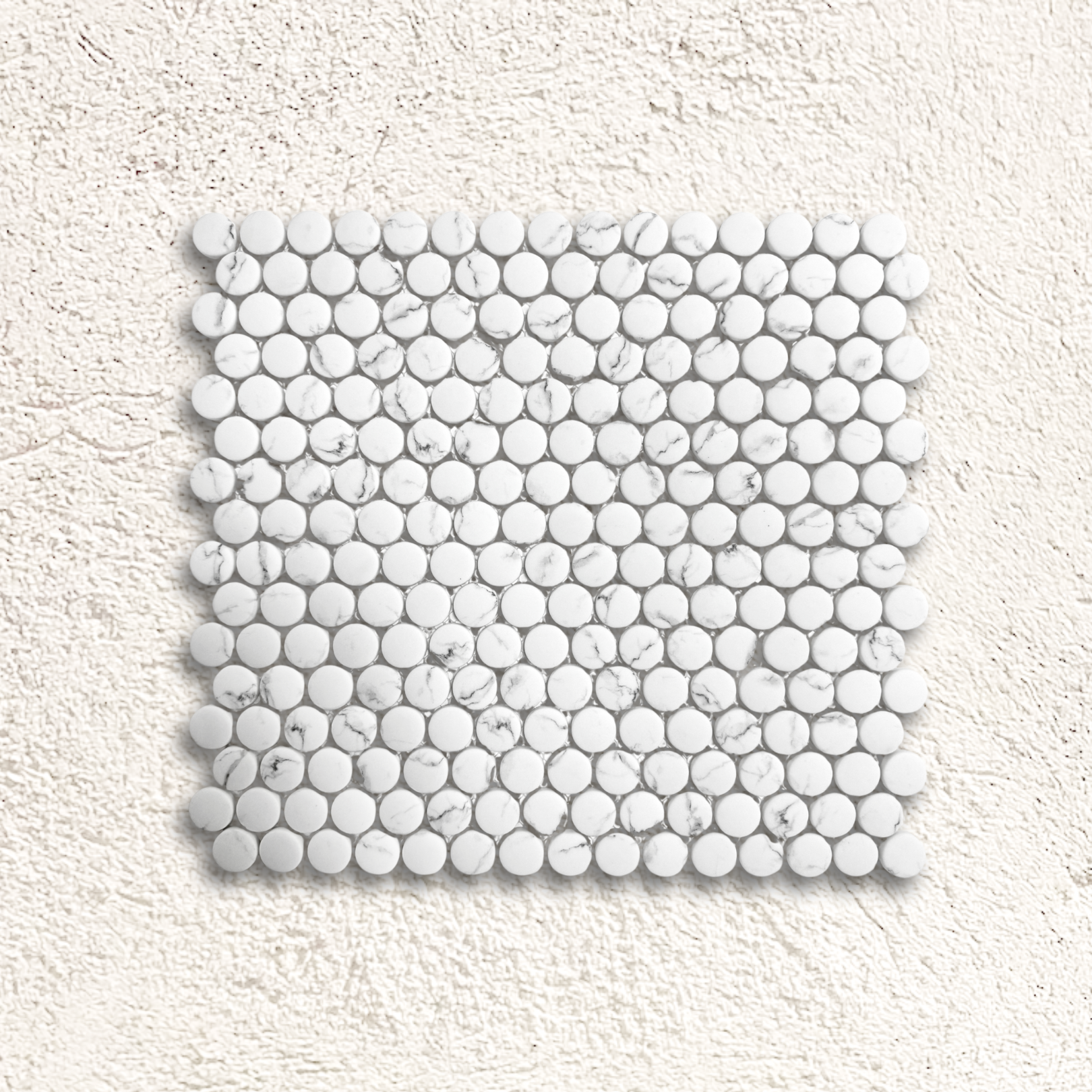White marble mosaic tile with round glossy pieces in a grid pattern from Ritz Statuario round mosaic collection