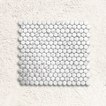 White marble mosaic tile with round glossy pieces in a grid pattern from Ritz Statuario round mosaic collection