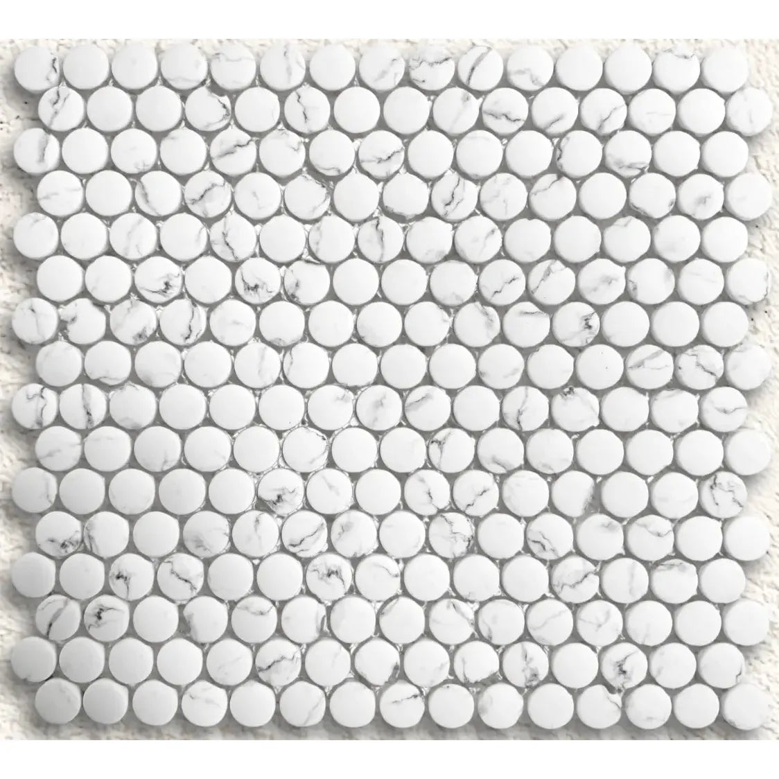 White marble mosaic tile with round glossy pieces in a grid pattern from Ritz Statuario round mosaic collection