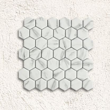 Ritz carrara hexagon mosaic white marble tile with subtle gray veining in a hexagonal pattern