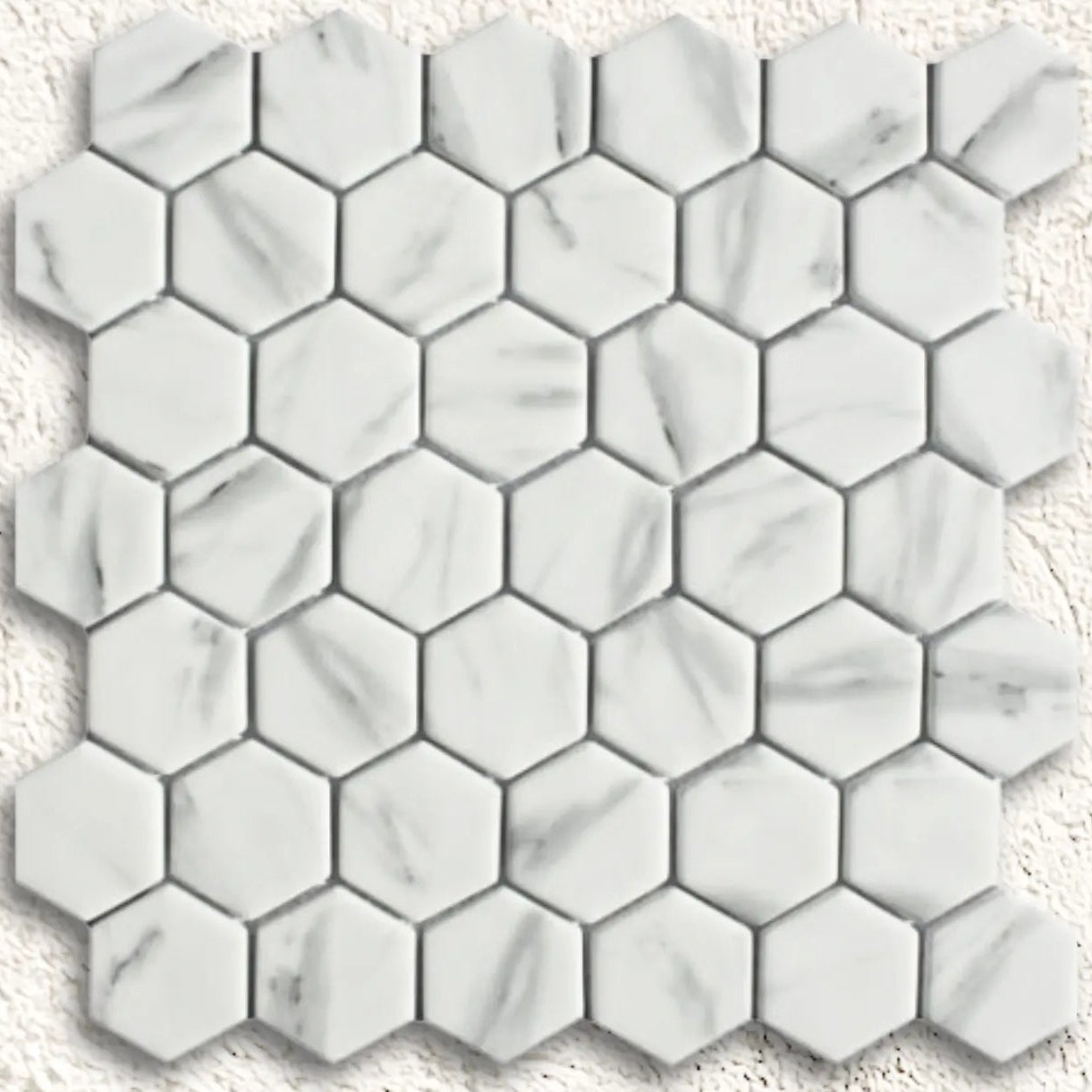 Ritz carrara hexagon mosaic white marble tile with subtle gray veining in a hexagonal pattern