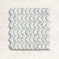White marble mosaic tile featuring a diamond chevron pattern in ritz carrara for stylish wall or floor decor