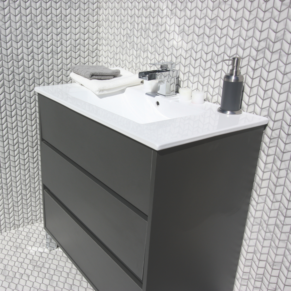 Ritz Carrara Diamond Chevron Mosaic marble tiles styled in a bathroom