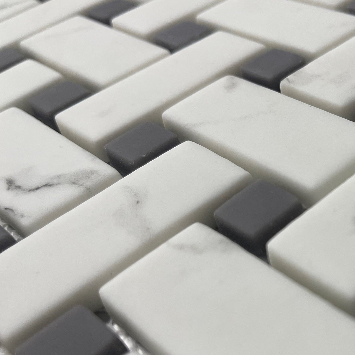 Ritz Carrara Grey basketweave mosaic with white and dark gray marble pattern rectangular tiles in brick layout