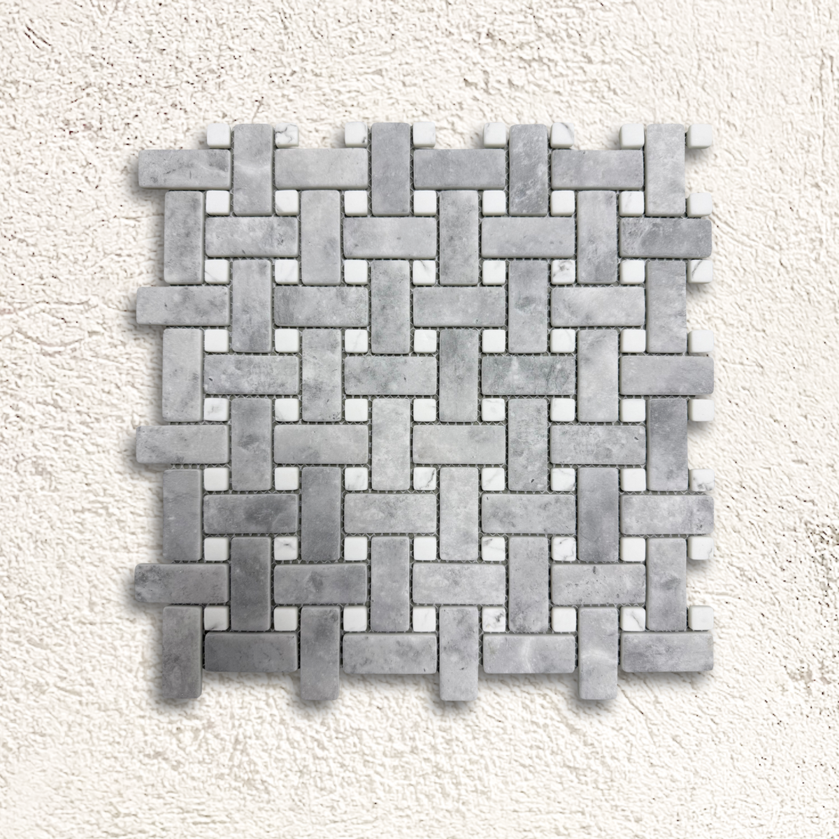 Ritz Grey Marble Carrara basketweave mosaic tile featuring gray marble with small white square accents