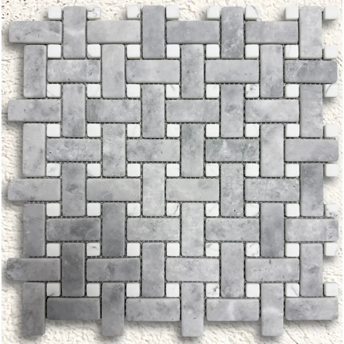 Ritz Grey Marble Carrara basketweave mosaic tile featuring gray marble with small white square accents