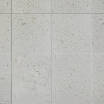 Brushed Shellstone limestone used on a bathroom wall beside pale joinery