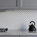 Full sheet of Carrara white and platinum grey tumbled marble flower mosaic laid flat