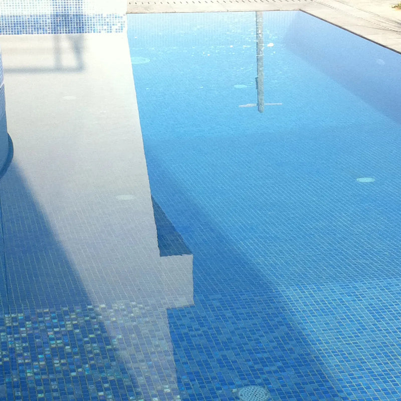 Abalon Cerulean mid blue glass mosaic tiles shown as a shower wall