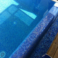 Abalon Cerulean mid blue glass mosaic tiles shown as a feature wall