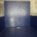 Abalon Azure blue glass mosaic tiles shown as a shower wall