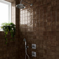 Dakota Chocolate zellige-style gloss tiles styled with warm interior decor