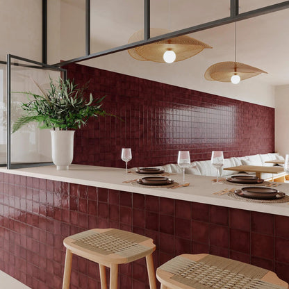 Dakota Port zellige-style gloss tiles styled with rich interior decor