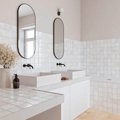 Dakota Pearl white gloss zellige-style wall tiles in a styled room