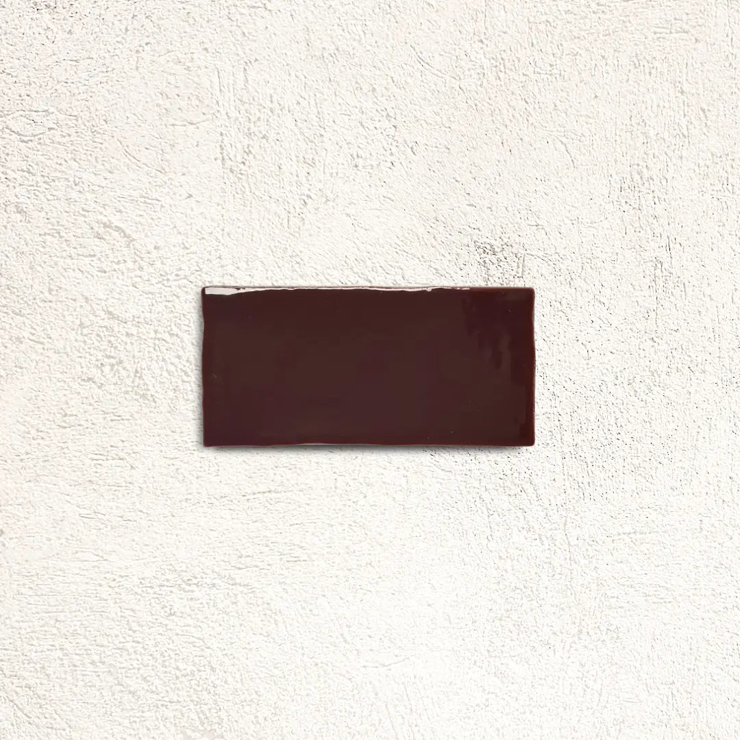 Remy Wine red gloss brick wall tile 6.5 x 13cm shown in a room setting