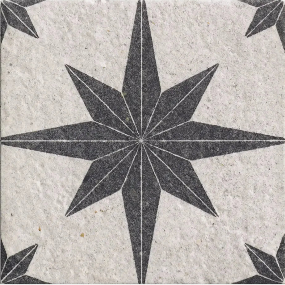 Tile with a star pattern on a textured surface
