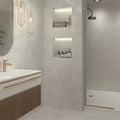 Modern bathroom with sink, mirror, and shower area.
