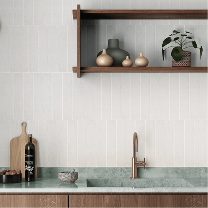 Sutton Snow 6 x 30cm stone-effect porcelain tiles shown in a room setting