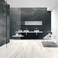 Modern bathroom with dark tiled walls and light wooden floor
