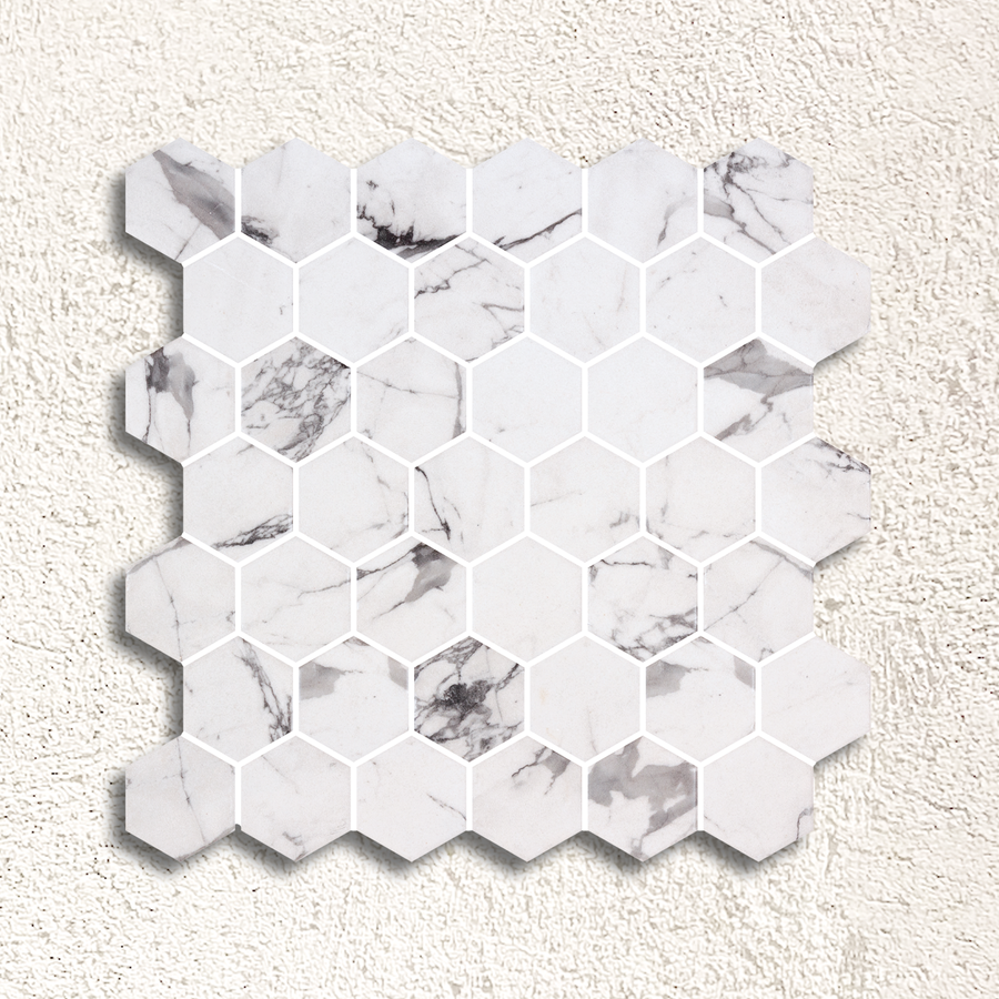White hexagonal marble mosaic tile with subtle gray veining in hex xl fosco matte mosaic design
