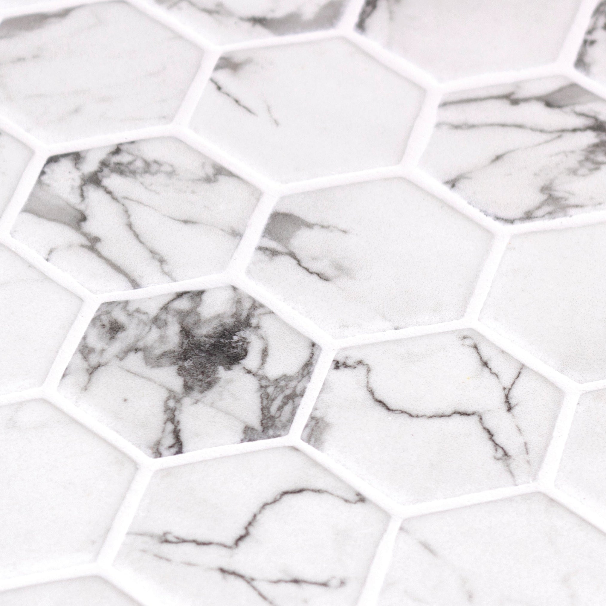 White hexagonal mosaic tiles with gray marble veining in hex xl fosco matte mosaic for wall and floor use