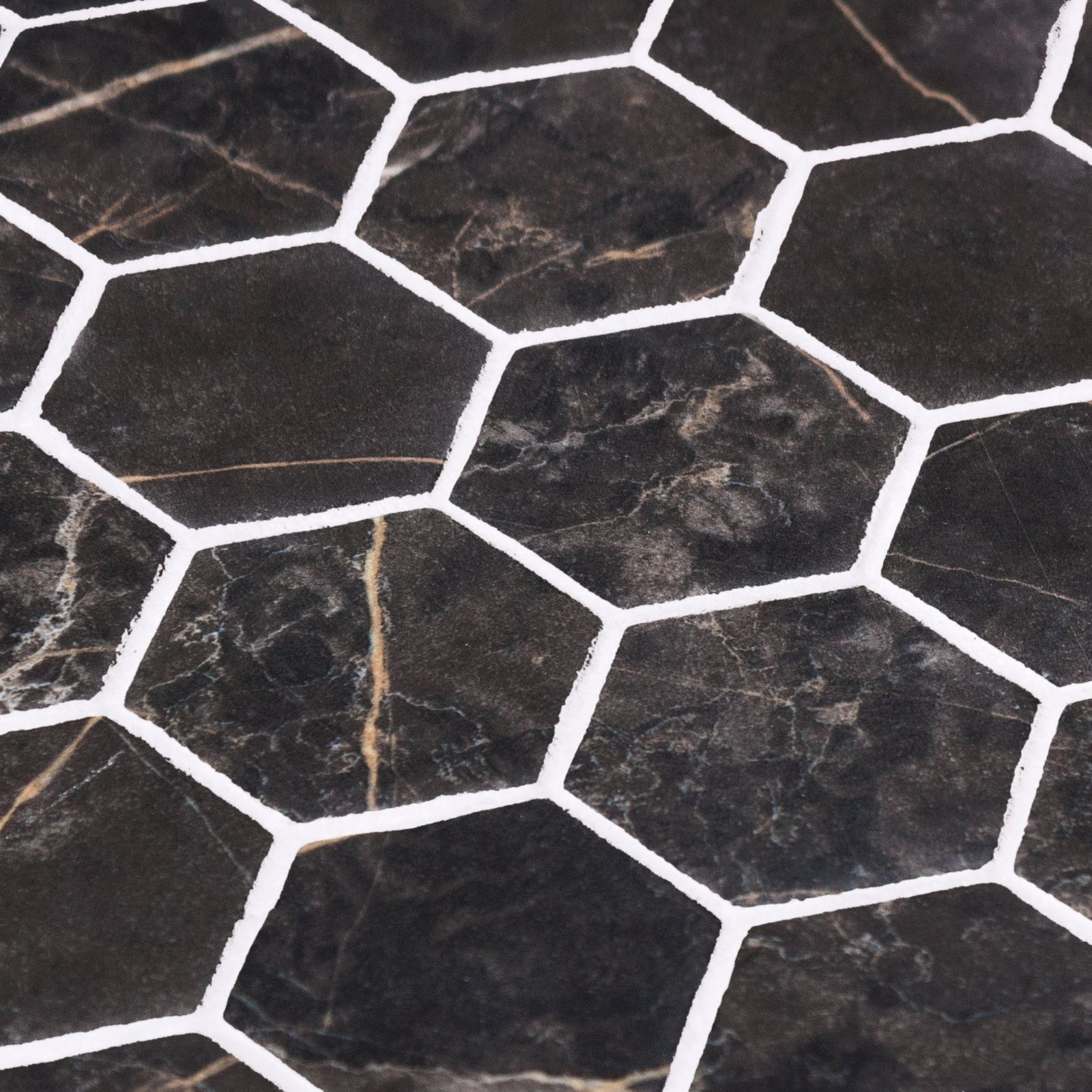 Dark gray hex xl coimbra matte mosaic tiles with subtle gold veining separated by crisp white grout lines