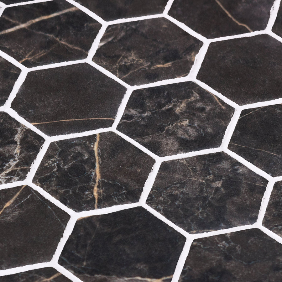 Dark gray hex xl coimbra matte mosaic tiles with subtle gold veining separated by crisp white grout lines