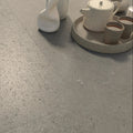 Osso Greige grey-beige brushed stone-effect porcelain tiles in a room setting