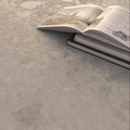 Bord Bone soft beige large-format porcelain tiles in a room setting