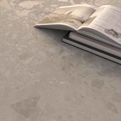 Bord Bone soft beige large-format porcelain tiles in a room setting