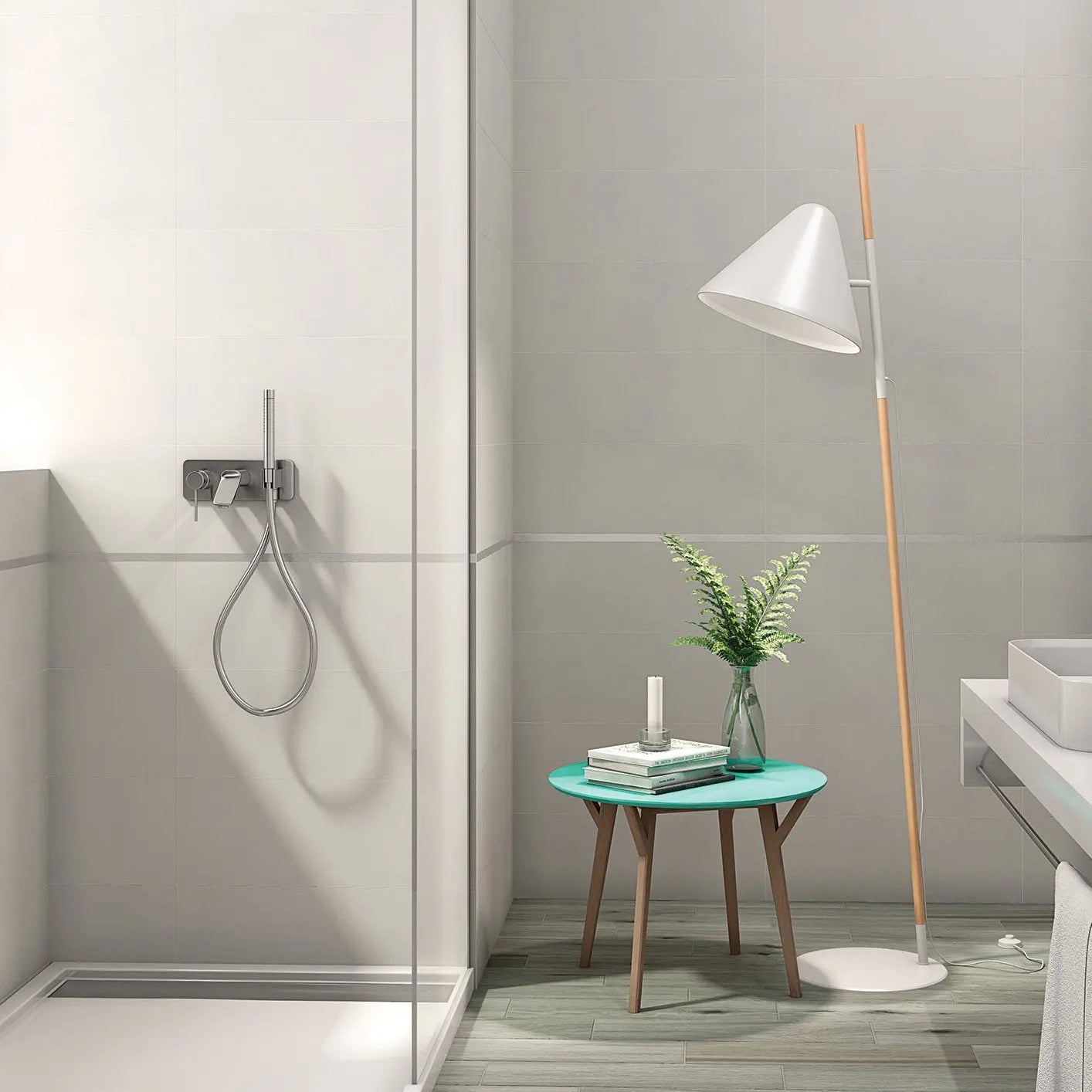 Modern bathroom with a shower, sink, and small table with decor items.