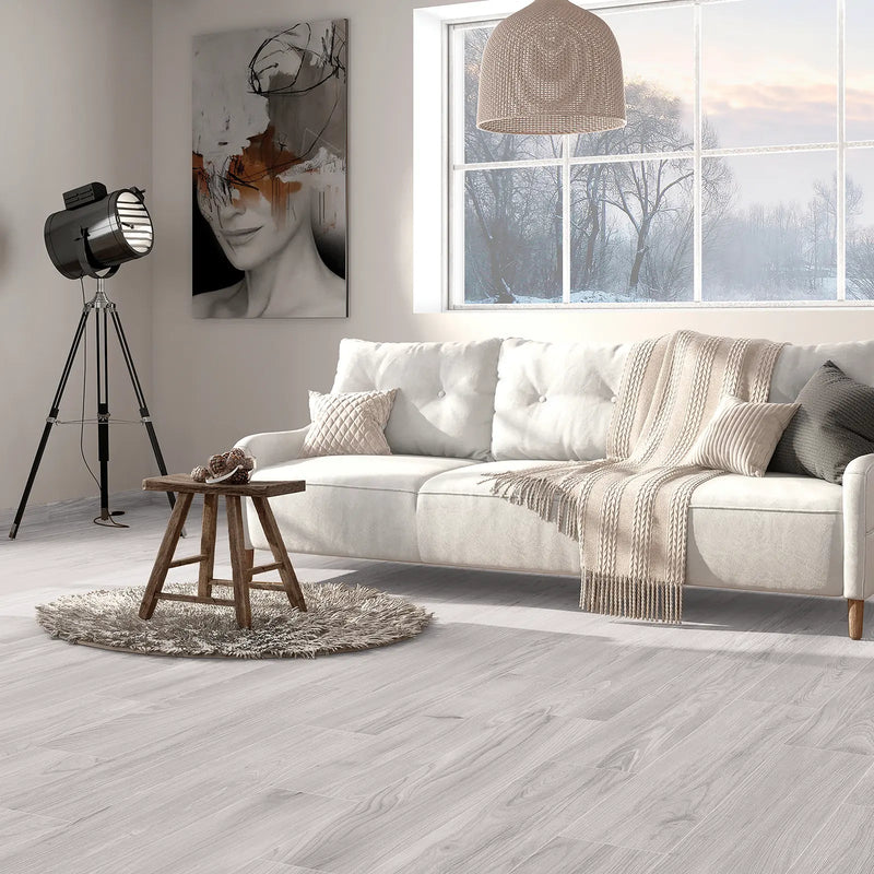 Aire Blanco 20x120cm pale grey wood effect porcelain plank flooring in a room setting